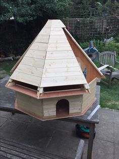 a bird house built on top of a bench