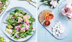 two plates with salads and orange slices on them