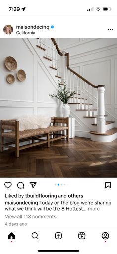 a white room with wooden floors and stairs