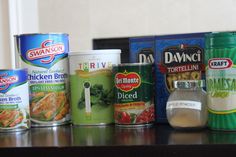 several canned food items lined up on a table