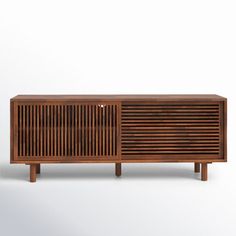 the sideboard is made out of wood and has an interesting pattern on it's sides