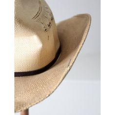 This vintage Rockmount Ranch Wear hat is as classic as they come. With a black hat band and crease, you can make a traditional western statement. The distressed look gives the straw hat a unique character, with darkening and subtle streaking of the tone. The style of hat is "Desert Wind."   MARKED SIZE:  7 3/8 MEASUREMENTS Circumference:  22.75"  ..  57.8 cm Brim:  3.75"  ..  9.5 cm Height:  5"  ..  12.7 cm Rigid Short Brim Fedora For Western-themed Events, Short Brim Rigid Fedora For Western-themed Events, Country Style Short Brim Hat In Toquilla Straw, Country Style Short Brim Toquilla Straw Hat, Rustic Fedora Panama Hat For Rodeo, Rustic Curved Brim Straw Hat For Kentucky Derby, Rustic Adjustable Brimmed Top Hat, Rustic Panama Hat With Curved Brim For Rodeo, Western Boater Hat For Rodeo With Flat Crown