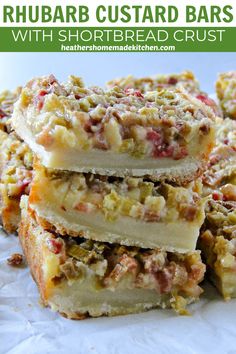 rhubarb custard bars with shortbread crust are stacked on top of each other