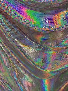 an abstract image of multicolored sequins and metallic foil on the surface