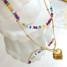 Style: Female Material: Titanium Steel, Imitation Pearl, Crystal Beads Pearl Type: Uncultured Pearl Color: White Necklace Length: 40 / 46)+5cm Heart Pendant:1.3*1.5cm Beaded Metal Layered Necklace As Gift, Double Heart Beads Necklaces For Jewelry Making, Gold Heart Necklace With Colorful Beads, Gold Heart Jewelry With Colorful Beads, Multicolor Beaded Heart Pendant Necklace, Gold Heart-shaped Jewelry With Colorful Beads, Multicolor Heart Necklace With Heart Beads, Multicolor Heart Beads Heart Necklace, Adjustable Colorful Beads Necklace For Valentine's Day