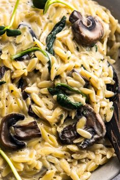 pasta with mushrooms and spinach in a bowl