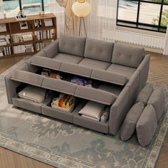 a living room scene with focus on the couch and storage compartment in the center area