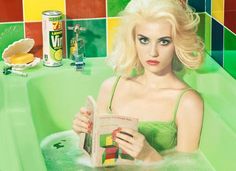 a painting of a woman sitting in a bathtub holding a can of lemonade