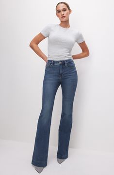 Rock a retro-inspired silhouette in these high-waist jeans punctuated with flared hems and crafted with just a hint of stretch. 33 1/2" inseam; 22" leg opening; 11" front rise; 15 1/2" back rise (size 8) 70% cotton, 26% polyester, 3% rayon, 1% elastane or 98% cotton, 2% elastane Machine wash, tumble dry Imported Black Owned/Founded Ralph Lauren Girl, Shaping Jeans, Wrap Clothing, Cami Nyc, Cashmere Accessories, Summer Capsule Wardrobe, Pullover Cardigan, Summer Capsule, Long Midi Dress