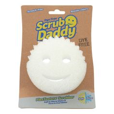 the scrubby daddy face is white and has a smile on it's face