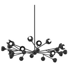 a black chandelier with eight lights hanging from it's center and six arms