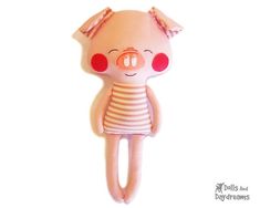 a pink stuffed animal with red eyes and a striped dress on it's head