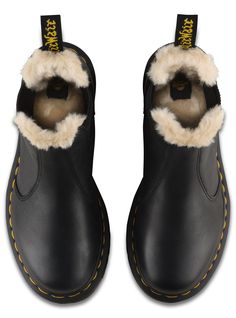 The Leonore Chelsea boot combines the androgynous elements of the style with a slender, feminine silhouette. In other words? An uncompromisingly fashion-forward look and feel. Then, we winterized it, lining it in soft, artificial white fur. Lined with soft faux fur Made with classic Doc's DNA, including grooved edges, visible stitching and heel-loop Built on the iconic Dr. Martens air-cushioned sole, which is oil and fat resistant with good abrasion and slip resistance Material Leather with a su Fall Winter Shoes, Dr Martens Womens, Boots Uk, Thick Socks, White Fur, Flat Boots, Winter Shoes, Black Ankle Boots, Dr. Martens