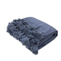 a blue blanket with pom poms on it