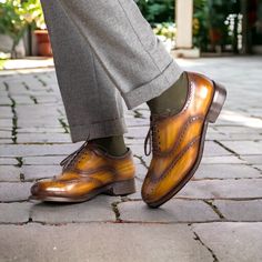 Handmade in 7 days. Made in Spain This beautiful cognac patina finish is all made by hand. Not only is the shoe hand sewn, but the finish is hand rubbed to achieve that antique coloration of slight burnishing rubbed into the patina. A classic wing tip style lace up, the full brogue has the perforated medallion on the toe box. Great for spring, summer and fall with suits, trousers and jeans. Brown Italian Wingtip Dress Shoes, Cognac Cap Toe Oxfords With Goodyear Welt, Cognac Goodyear Welted Cap Toe Dress Shoes, Cognac Cap Toe Dress Shoes Goodyear Welted, Cognac Cap Toe Dress Shoes With Goodyear Welted, Brown Goodyear Welted Wingtip Dress Shoes, Cognac Goodyear Welted Wingtip Oxfords, Cognac Goodyear Welted Wingtip Leather Shoes, Brown Italian Wingtip Leather Shoes