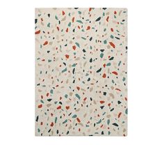 a white rug with multicolored spots on it