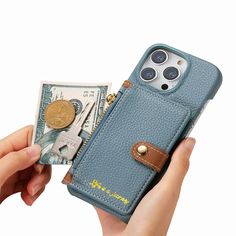 a person holding an iphone case with money in front of it and a coin sticking out of the back