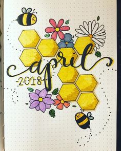 an open notebook with bees and flowers on it