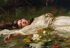 a painting of a woman laying on the ground next to lily pads in a body of water