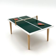 a ping pong table with two paddles on it