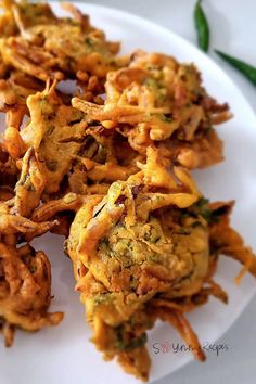 some fried food is on a white plate