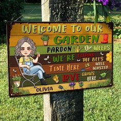 a wooden sign that says welcome to our garden