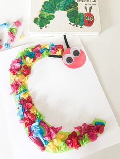 the very hungry caterpillar craft is made with tissue paper, scissors and glue