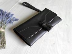 This romantic tassel clutch bag is handmade from a medium thickness smooth dark brown cowhide leather. The wristlet purse can be worm as a day clutch or as an evening accessory. It's spacious enough for your phone, wallet, keys, lipstick and more. The clutch purse has a detachable leather strap to keep it safely on your wrist. DIMENSIONS + width 11.4" / 29 cm + height 6.3" / 16 cm COLOR + dark brown color leather  + antique brass color hardware MATERIALS + natural cowhide leather + softer leathe Luxury Brown Clutch Wallet, Luxury Brown Clutch For Daily Use, Hardware Materials, Brown Leather Clutch, Evening Accessories, Leather Clutch Bag, Wristlet Purse, Leather Clutch Bags, Wristlet Wallet