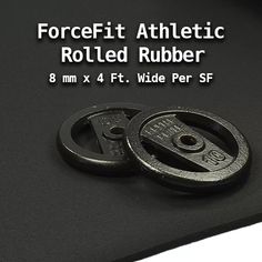 two black rubber wheels on top of a white surface with the text forcefit athletic rolled rubber