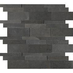 a black tile wall that has been made out of different pieces of gray slate tiles