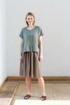 "Handmade with love and care Oeko-tex certified 100% linen skirt which is crafted by local tailors in Lithuania (EU member). It goes perfectly with any of our blouses (you will find below some recommendations)! Look sharp all day long! Length: ±24\"/60cm Pockets: side seam Waistband: elastic Details: *Colour shown: wood brown (1st picture) *Model is wearing size M *High-waisted *Deep pockets *Medium weight (185 g) *Not-ironed (and no need to) *Handcrafted by @LinenCloud Easy care: - Machine wash Casual Linen Tiered Skirt, Casual Linen Tiered Skirt Bottoms, Linen Long Skirt With Relaxed Fit, Linen Skirt With Relaxed Fit And Lining, Green Linen Relaxed Fit Skirt, Linen Green Lined Skirt Bottoms, Green Linen Lined Skirt Bottoms, Casual Green Linen Skirt, Linen Pleated Skirt