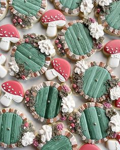 decorated cookies are arranged on a white surface