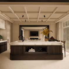 a large kitchen with marble counter tops and wooden cabinets