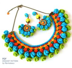 a crochet necklace and earring set with matching earrings on a white background