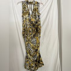 This Beautiful Venus Dress Features A Stylish Paisley Pattern In Shades Of Yellow And Gray. The Dress Has A High Neckline And Sleeveless Design, Making It Perfect For Both Casual And Party Occasions. It's Made Of A Comfortable Polyester Material With A Touch Of Elastane For Added Stretch. The Dress Has A Bodycon Style And Falls To A Midi Length. It's A Regular Size M And Is Suitable For The Summer, Fall, And Spring Seasons. This Dress Is Brand New Without Tags And Sure To Make A Statement At Any Yellow Stretch Midi Dress For Beach, Yellow Stretch V-neck Maxi Dress, Yellow Stretch Maxi Dress With V-neck, Yellow Ruched V-neck Midi Dress, Yellow Halter Neck Midi Dress, Yellow Sleeveless Ruched Midi Dress, Yellow Ruched Sleeveless Midi Dress, Yellow Ruched Midi Dress For Beach, Yellow Ruched Maxi Dress For The Beach