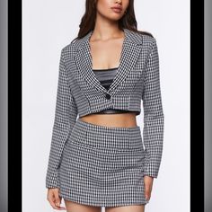 A Woven Set Featuring A Blazer With An Allover Boucle Check Pattern, Single-Breasted Construction, Notched Lapels, Long Sleeves, And A Cropped Hem, As Well As A Matching Skort With A High-Rise Waist, Front Welt Pockets, Concealed Side Zipper Closure, And A Mini Hem. Green Pictures Are To Show The Style. The Set I Have Is Black&White. Never Wore. Too Small For Me Now. Trendy Fitted Blazer For Night Out, Trendy Fitted Blazer For Date Night, Chic Fitted Blazer For Going Out, Fitted Blazer For Going Out In Spring, Trendy Fitted Cropped Jacket For Night Out, Fitted Spring Blazer For Going Out, Spring Fitted Blazer For Going Out, Fitted Casual Outerwear For Going Out, Winter Going Out Fitted Blazer