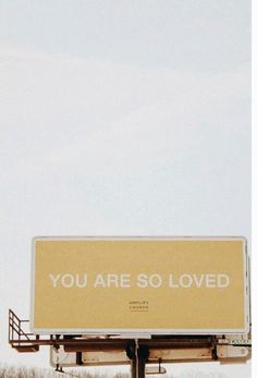 a billboard with the words you are so loved written on it