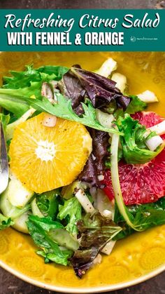 a yellow bowl filled with salad and orange slices