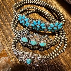 Expertly crafted with intricate detail, this Handmade Boho Navajo Turquoise Cabochon Flower Stretch Bracelet is a stunning addition to any jewelry collection. The beautiful and unique flower design, made with high-quality turquoise stones, adds a touch of natural elegance to any outfit. Gift box included for the perfect finishing touch. Three Piece Set Ships in Gift Box One Size Fits All, FAST shipping Southwestern Style Silver Beaded Bracelets For Gift, Southwestern Silver Beaded Bracelet For Gift, Adjustable Flower-shaped Costume Jewelry, Adjustable Flower Costume Jewelry, Gift Turquoise Metal Bracelets, Bohemian Turquoise Flower Jewelry, Southwestern Turquoise Bracelets As Gift, Southwestern Style Metal Jewelry For Gifts, Southwestern Style Metal Jewelry As Gift