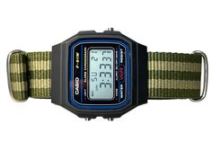 This retro Casio in stock form is already cool, functional, affordable, and accurate-- but with some magic from RLSWW, it's made even cooler-- with a ballistic nylon strap to match your personality. In addition-- you may select the option to modify the screen color to further reflect your tastes and bring some color to your wrist. Note, this is a permanent modification to the screen, not the LED backlight. It will be colored in all light conditions :) Please note: This is a permanent modificatio Adjustable Green Analog Watch, Casual Black Digital Watch With Adjustable Strap, Green Casual Watch For Outdoor Activities, Green Casual Digital Watch For Outdoor, Green Casual Sports Watch, Green Casual Outdoor Watch Accessories, Retro Black Watch With Stopwatch, Black Casio Watch, Screen Color