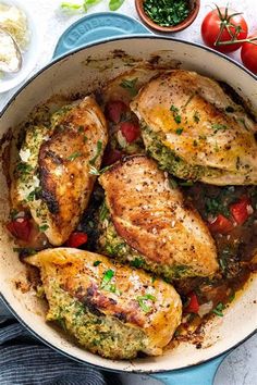 chicken with tomatoes and herbs in a pan