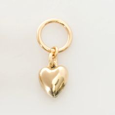 14k gold filled charm Puffy Heart Charm by LEILA Jewelry #CharmNecklace Valentine's Day Heart Charm, Valentine's Day Heart-shaped Open Heart Charms, Yellow Gold Heart Charm Round Pendant, Valentine's Day Heart-shaped Dangling Charms, Double Heart Charm For Gifts, Dainty Everyday Heart Charm, 14k Gold Heart Charm Pendant, 14k Gold Heart Charm As A Gift, Dainty Heart Charm For Everyday