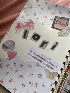 an open notebook with torn paper on it