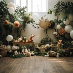 a room filled with lots of fake animals and greenery on the wall next to balloons