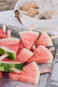 slices of watermelon on skewers with toothpicks