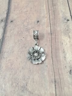 "Beautiful little poppy pendant on European style bail. (1 sided) You will receive 1 pendant. The poppy is pewter, and the bail is silver plated base metal. Perfect for necklaces, charm bracelets, zipper pulls, or other crafting needs! Approximate size:  1/2\" x 2/5\" bail & 3/4\" x 3/4\" poppy pendant. Made in USA" Silver Flower Charms For Gifts, Silver Flower Charm Pendant, August Flower, Tyler Tx, Poppy Design, Gift Flower, Birthstone Pendant, Birthstone Charms, Poppy Flower