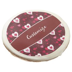 a round container with hearts on it and the word caring written in white lettering,