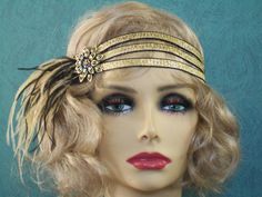 "Gold 1920s headband, Gatsby headband, 1920s headpiece, Black and Gold 1920s headband, Flapper headband, 1920s hair accessory, 1920s This stunning 1920's Vintage Inspired Gatsby headband is the perfect accompaniment for any 1920s styled event. I've designed and created this one of a kind headband so feminine and romantic. Made with three rows of Gold textured Satin elastic accompanied by Black and Antique Gold Ostrich feathers. The headband measures 21 1/2\" not stretched. I only use cruelty-fre Great Gatsby Accessories, 1920s Hair Accessories, Gatsby Accessories, Flapper Hair, Gatsby Hair, 1920s Headband, Gatsby Headpiece, Flapper Headpiece, Gatsby Headband