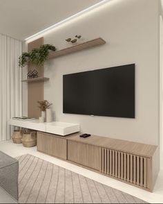 a flat screen tv mounted to the side of a wooden entertainment center in a living room