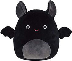 a black stuffed animal with large ears and eyes